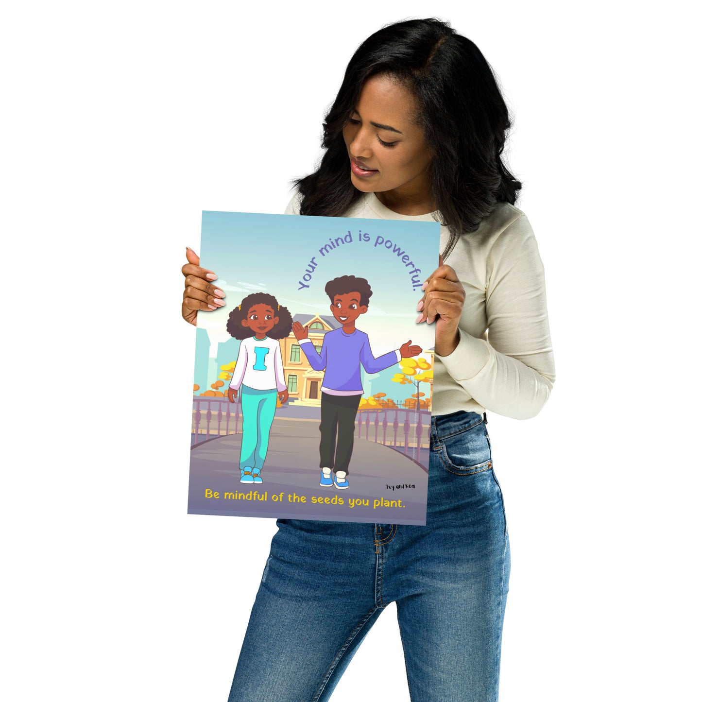 Woman holding a Ivy and Kem Your Mind Is Powerful poster against a white background.