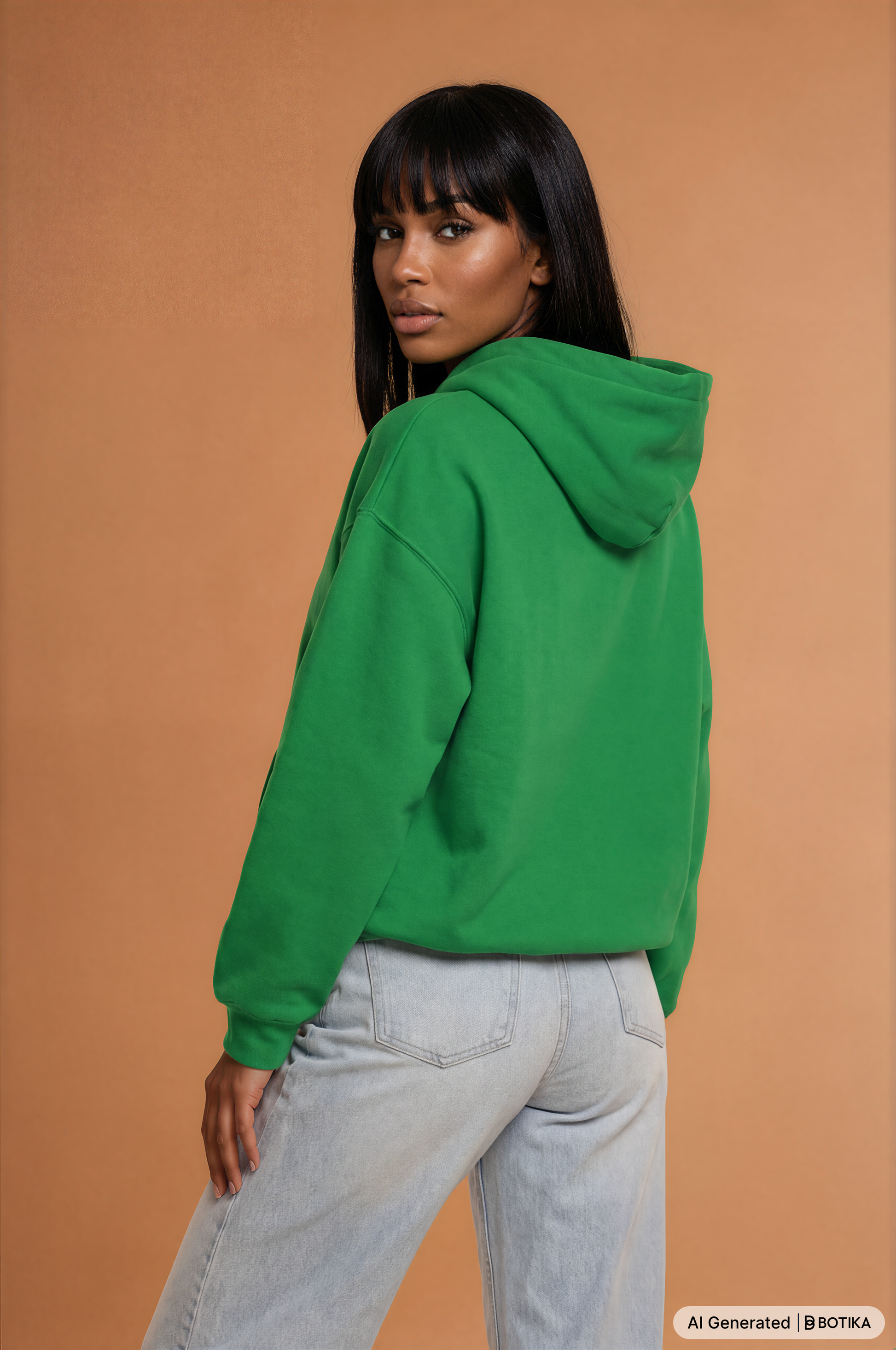 Woman wearing a kelly green Powerful Mind Club Brights hoodie, back view