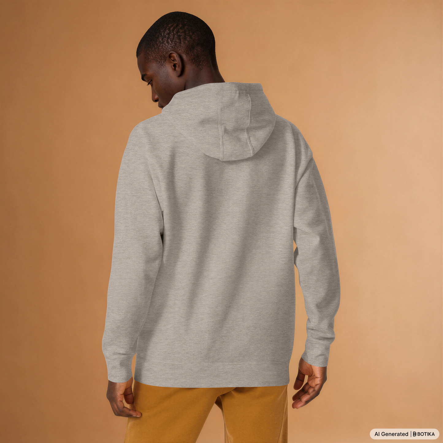 Man wearing a carbon grey Powerful Mind Club signature logo hoodie, back view