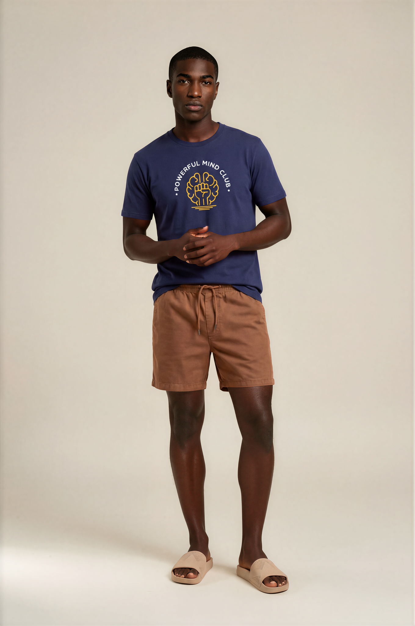 Man wearing a french navy blue Powerful Mind Club unisex organic t-shirt, back view