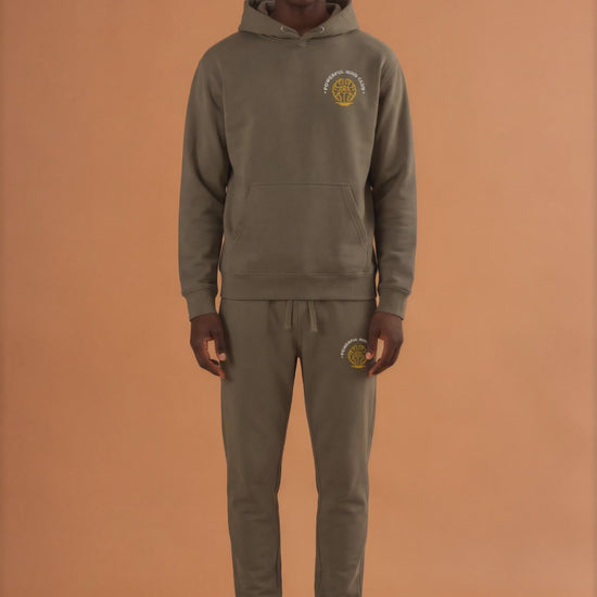 Man wearing a military green Powerful Mind Club Signature Set hoodie and joggers, front view video