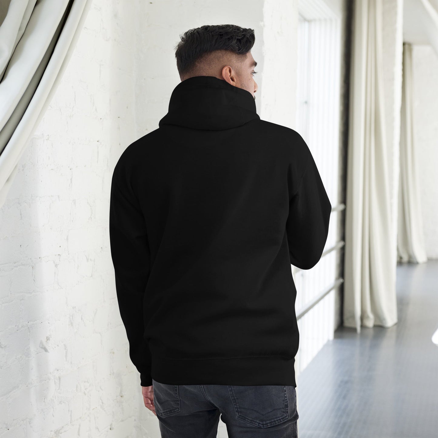 Man wearing Powerful Mind Club classic hoodie in black, back view